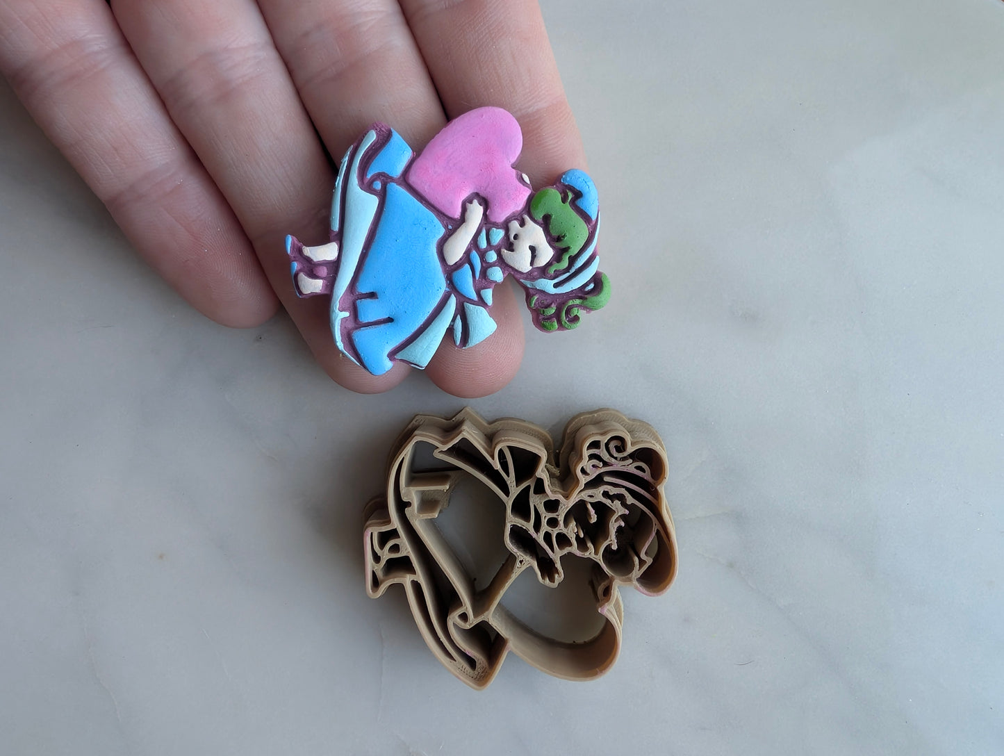 Vintage Girl in Full Dress Holding a Heart Sharp Clay Cutter
