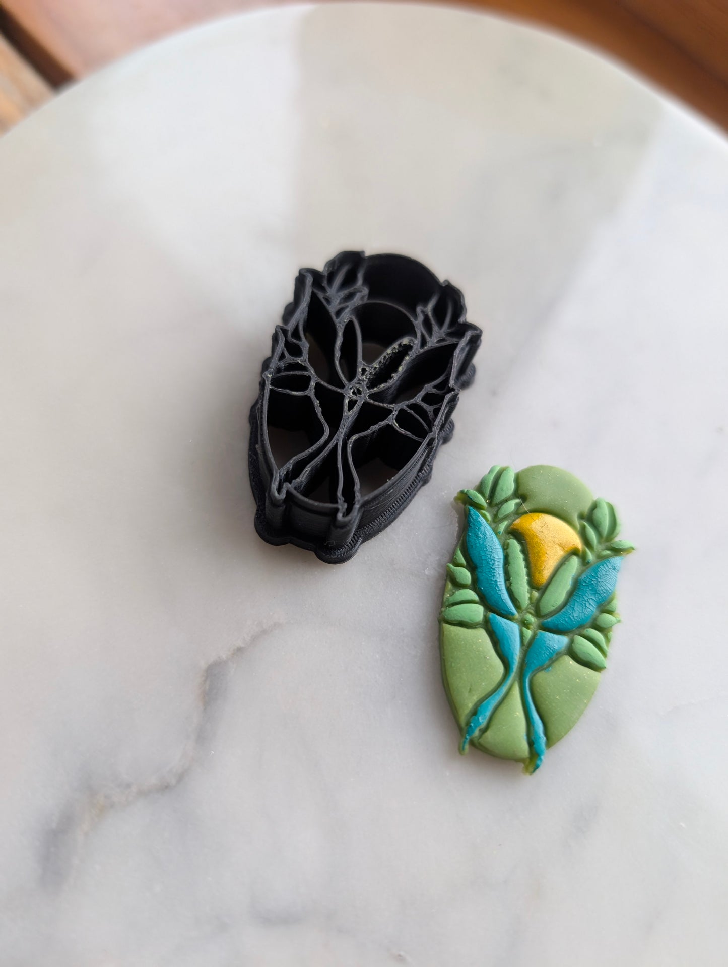 Luna Moth and Sun on Oval Sharp Clay Cutter
