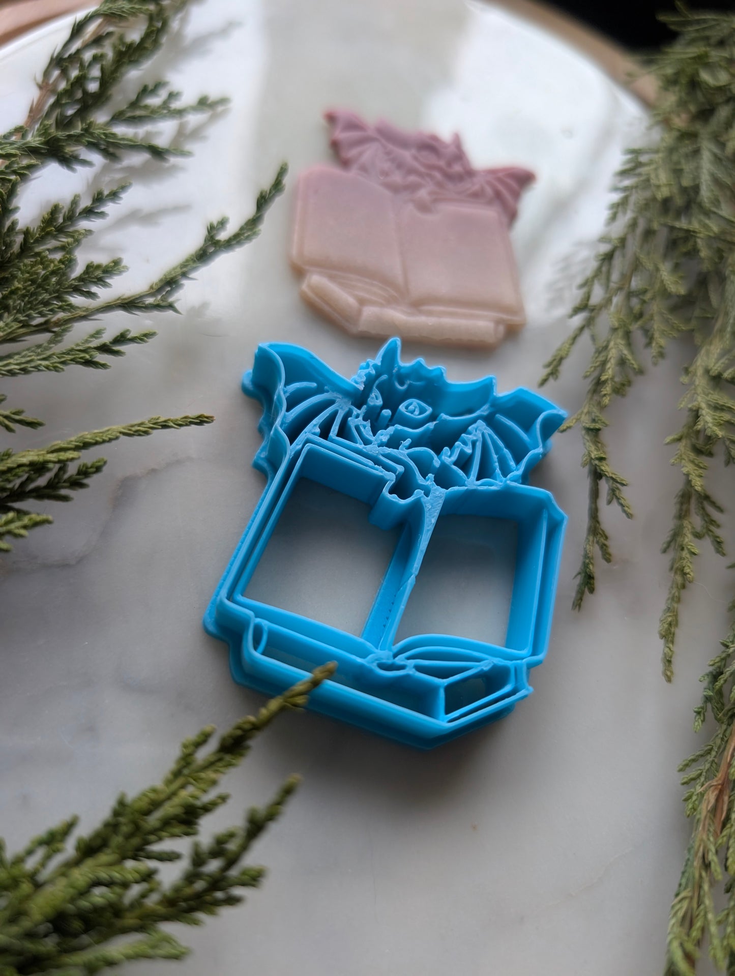 Dragon Behind Open Book Stack Sharp Clay Cutter