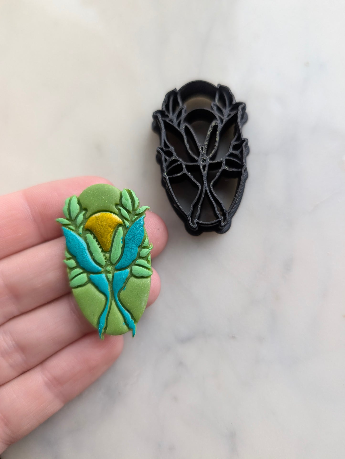 Luna Moth and Sun on Oval Sharp Clay Cutter
