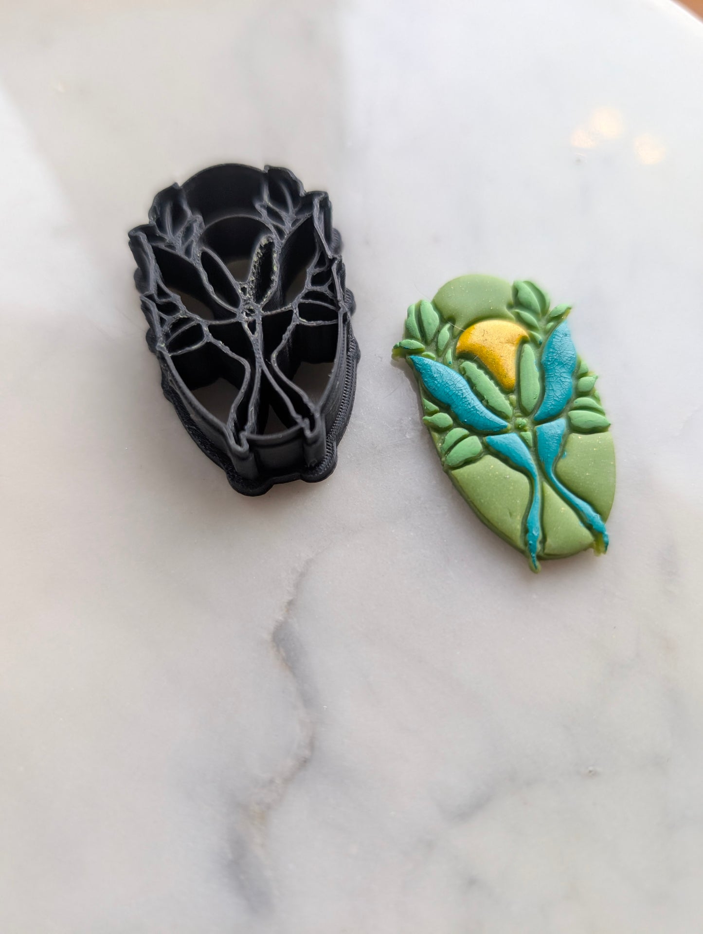 Luna Moth and Sun on Oval Sharp Clay Cutter