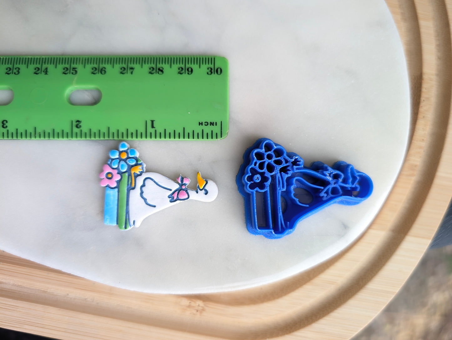 Goose Wearing a Bow Sitting on Books with Flowers Sharp Clay Cutter