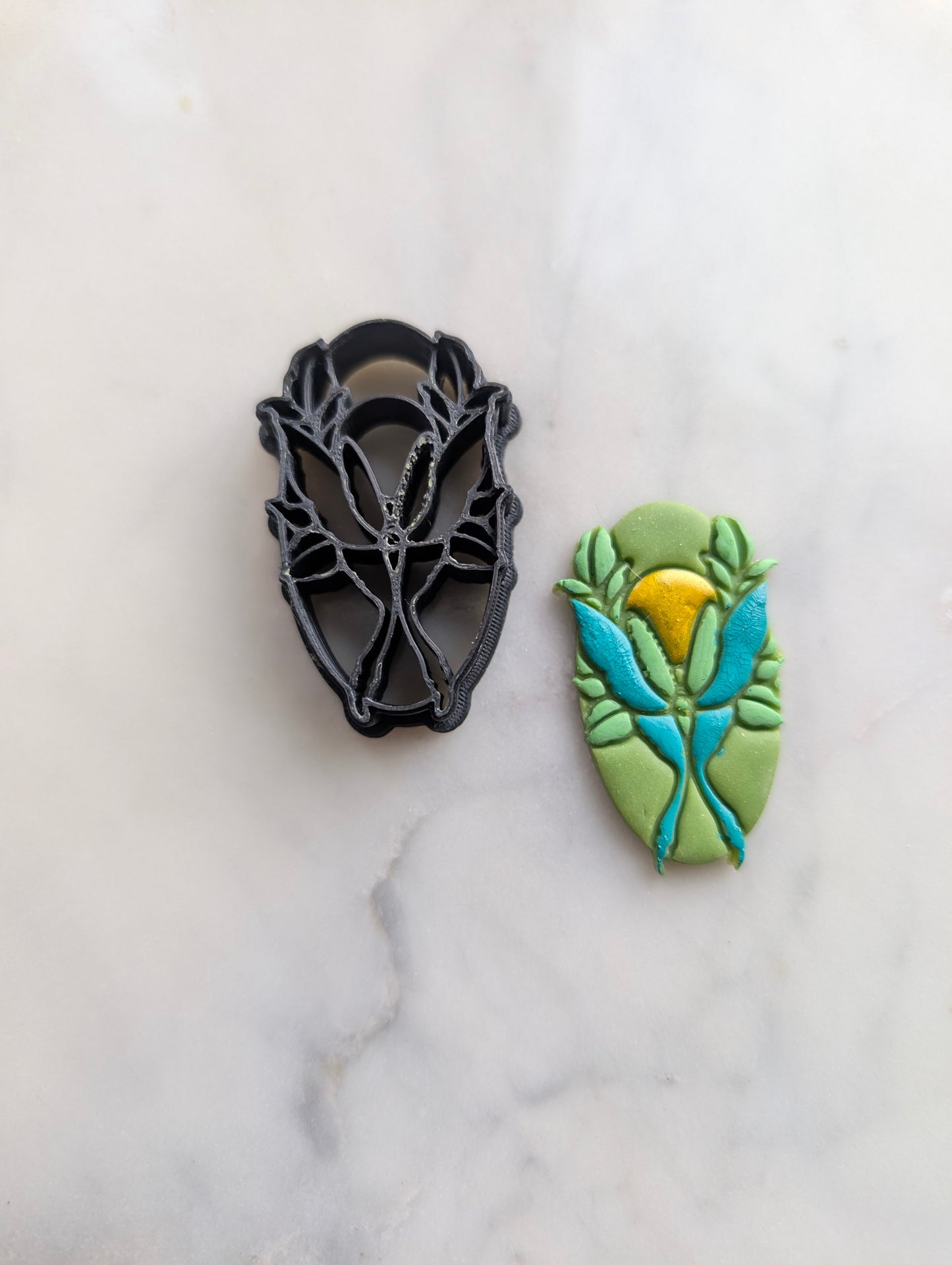 Luna Moth and Sun on Oval Sharp Clay Cutter