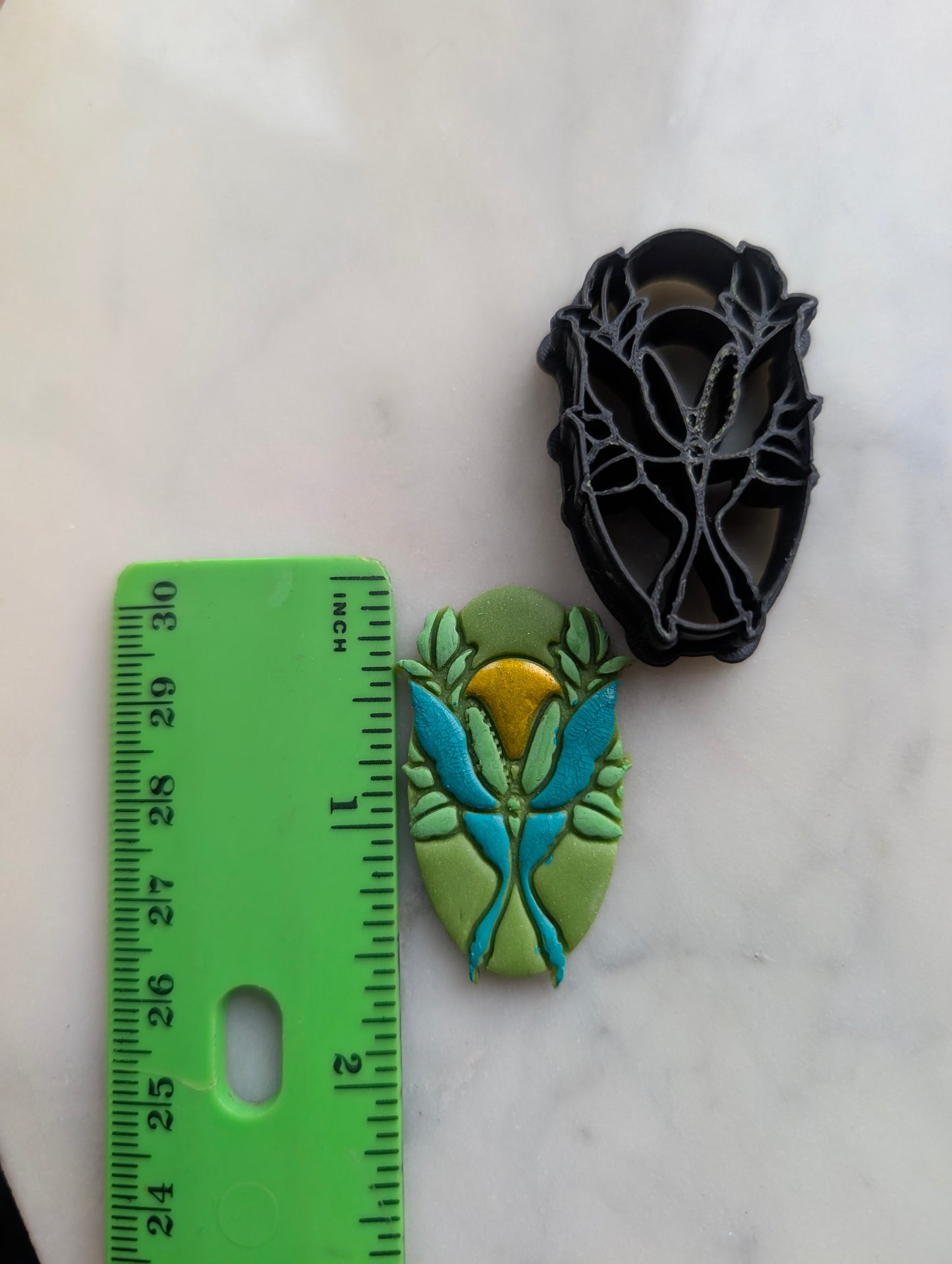 Luna Moth and Sun on Oval Sharp Clay Cutter