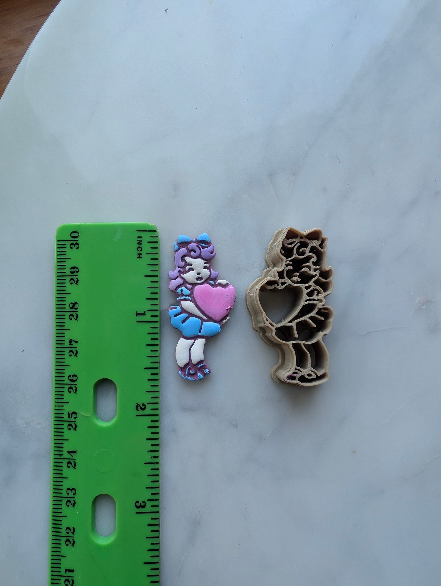 Vintage Girl in Short Dress Holding a Heart Sharp Clay Cutter