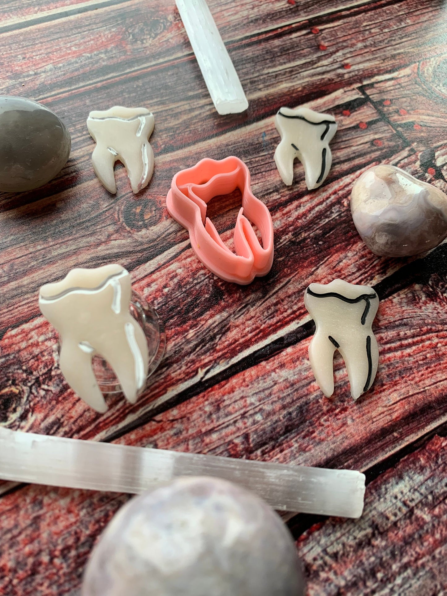 Tooth with Root Embossed Sharp Clay Cutter