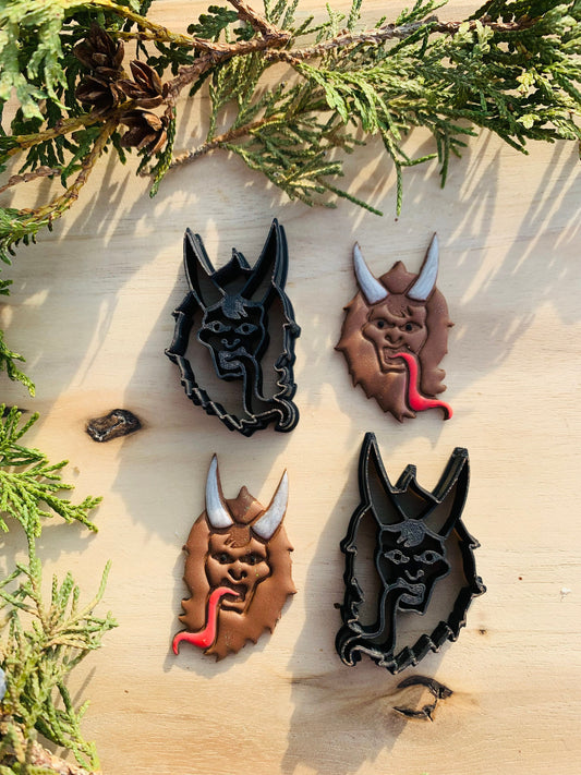 Mirrored Pair of Krampus Heads Embossed Sharp Clay Cutter